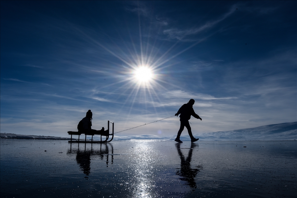 People enjoy winter at Lake Cildir