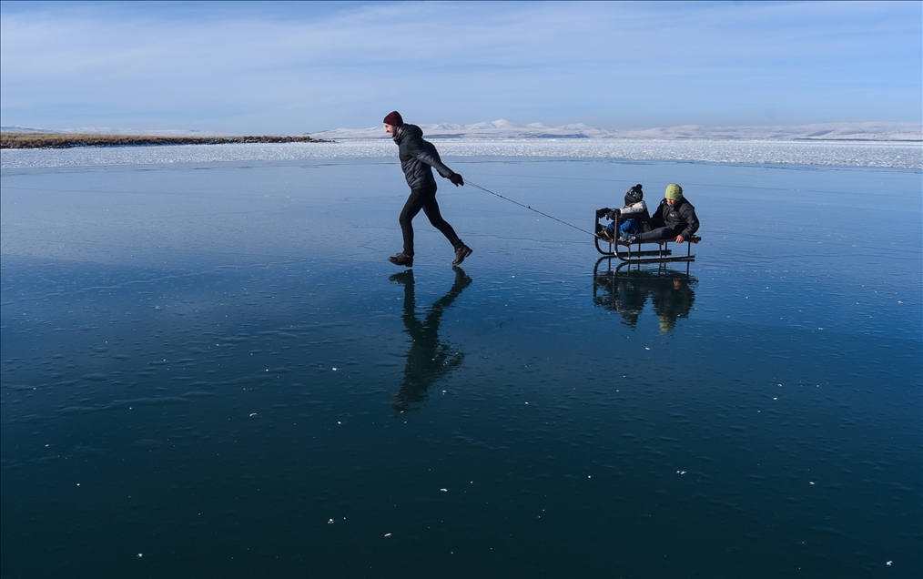 People enjoy winter at Lake Cildir