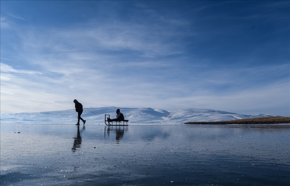 People enjoy winter at Lake Cildir