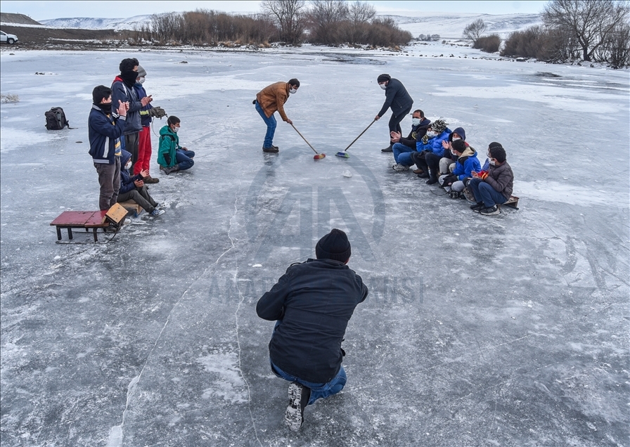 Villagers enjoy ice on the frozen Kars Stream