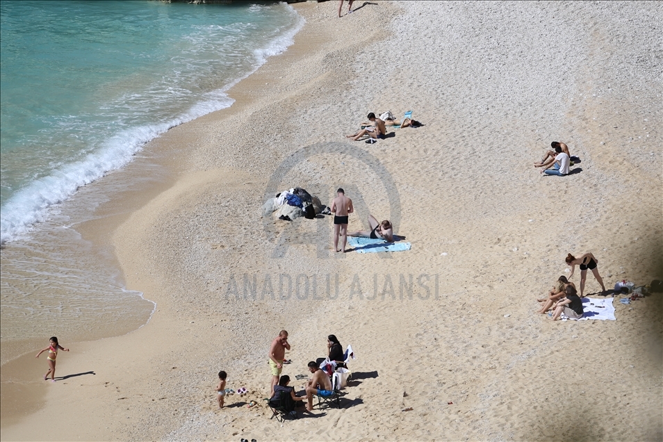 People enjoy beaches and warm weather in Antalya