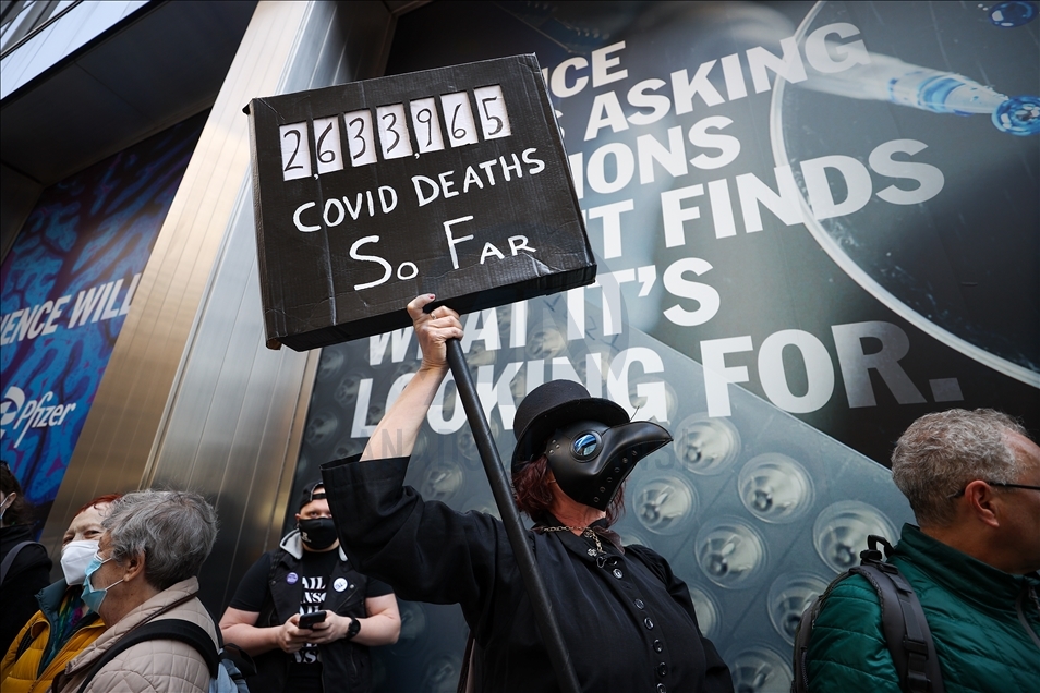 People gather at Pfizer HQ in NYC demanding equitable global vaccine distribution