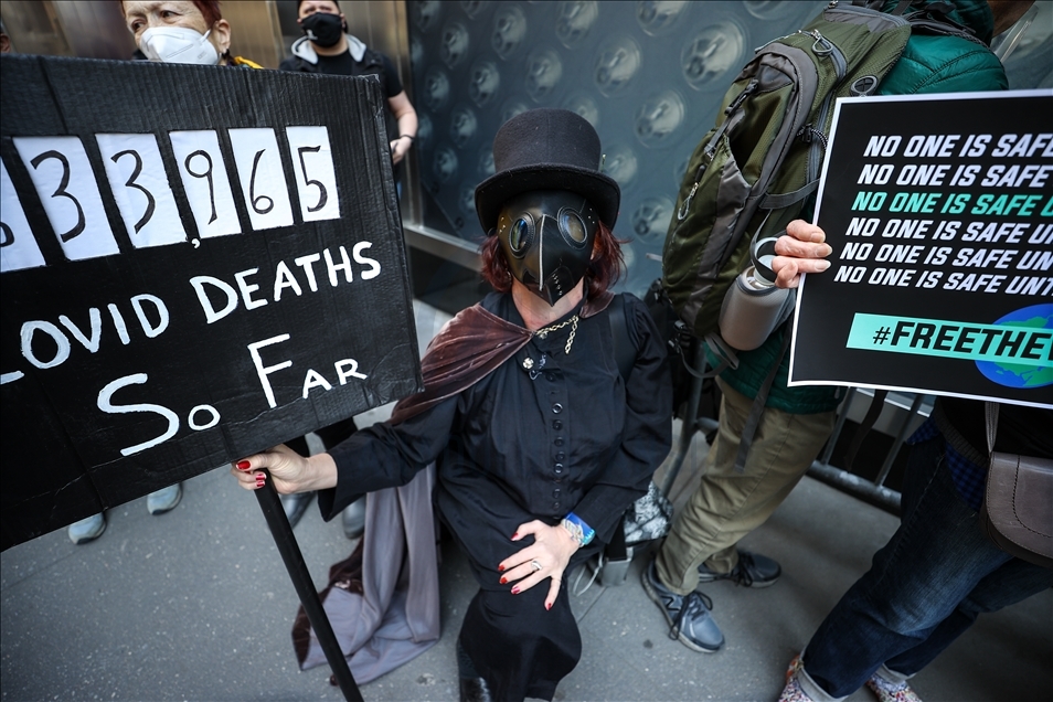 People gather at Pfizer HQ in NYC demanding equitable global vaccine distribution