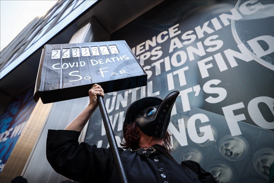 People gather at Pfizer HQ in NYC demanding equitable global vaccine distribution