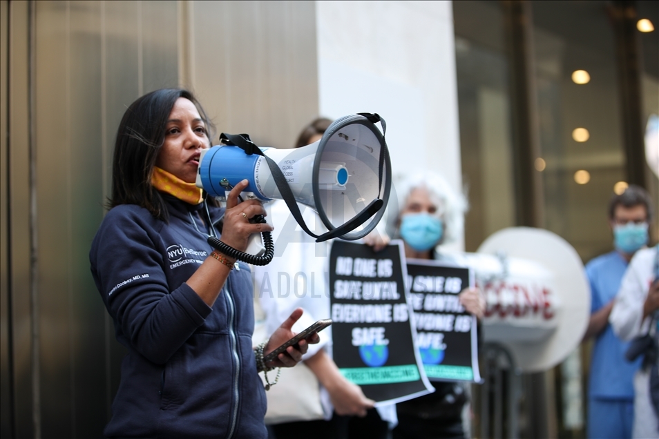 People gather at Pfizer HQ in NYC demanding equitable global vaccine distribution