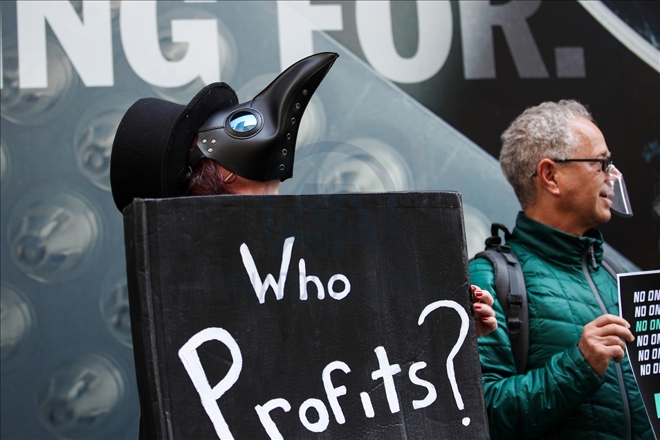 People gather at Pfizer HQ in NYC demanding equitable global vaccine distribution