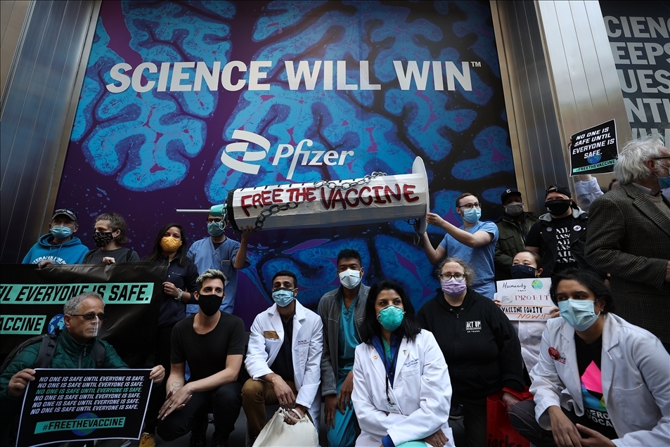 People gather at Pfizer HQ in NYC demanding equitable global vaccine distribution