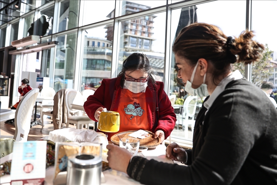 Young people with down syndrome raise awareness by working at a cafe in Istanbul