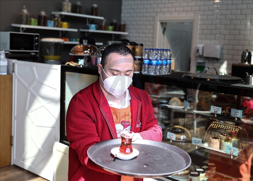 Young people with down syndrome raise awareness by working at a cafe in Istanbul