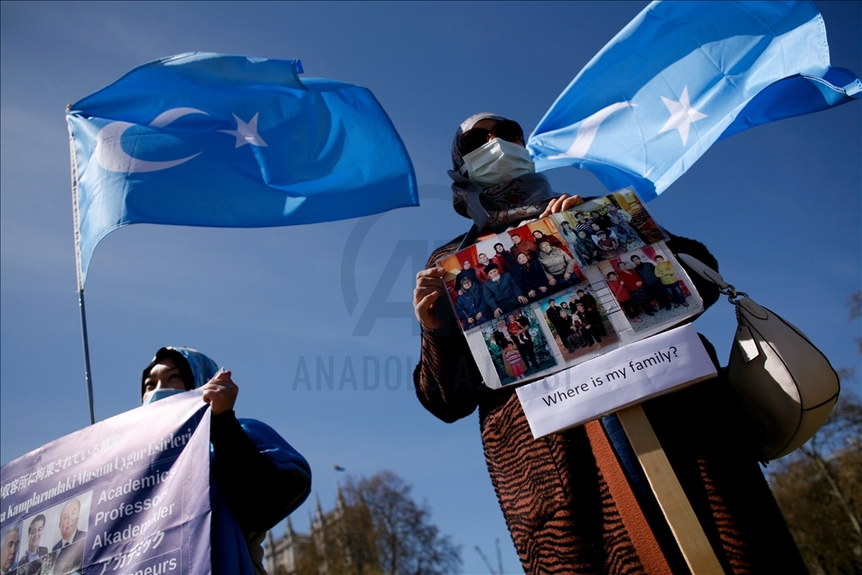 Activists protest outside Parliament as MPs debate China's treatment of Uighur Muslims