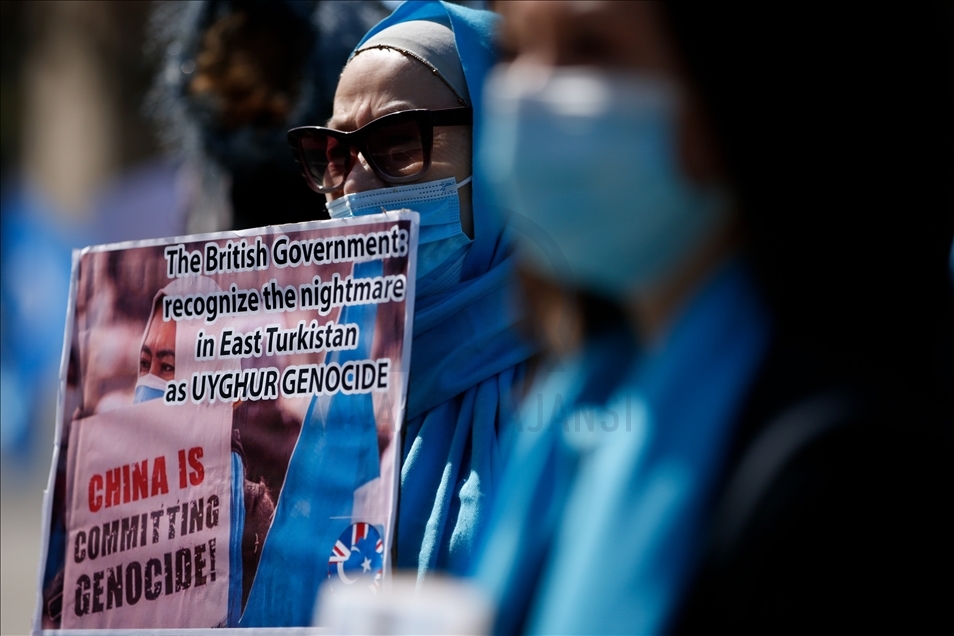 Activists protest outside Parliament as MPs debate China's treatment of Uighur Muslims