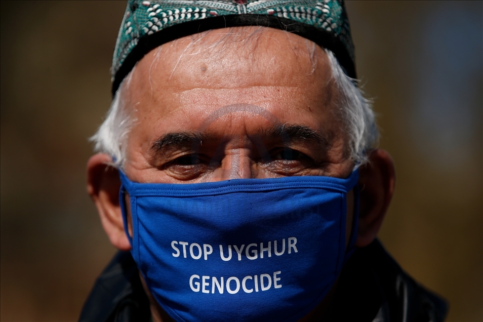Activists protest outside Parliament as MPs debate China's treatment of Uighur Muslims