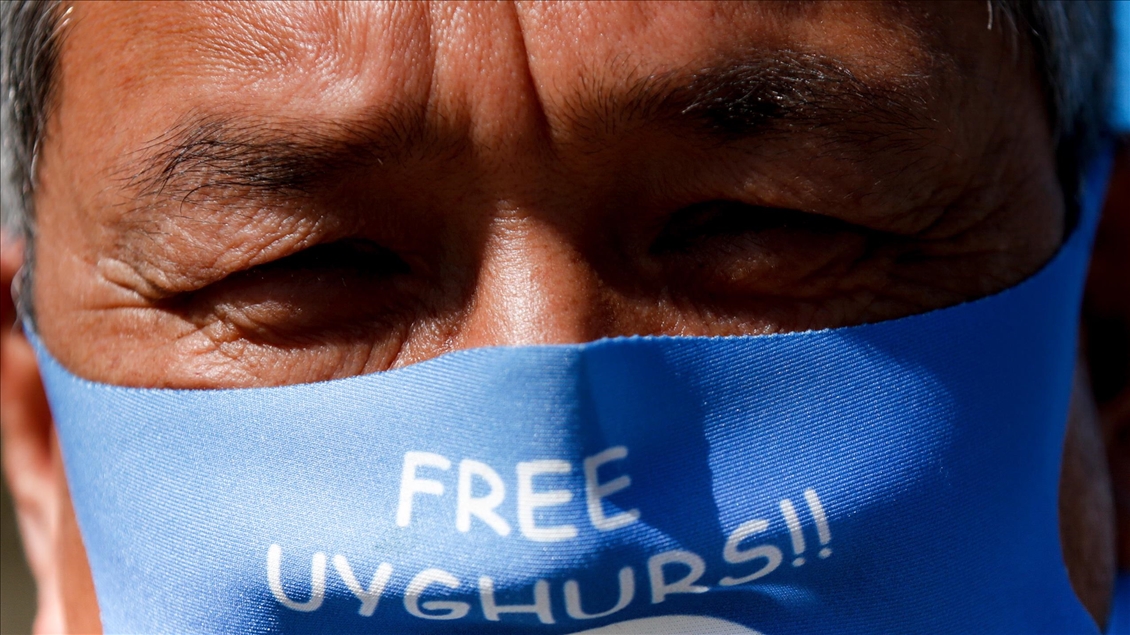 Activists protest outside Parliament as MPs debate China's treatment of Uighur Muslims