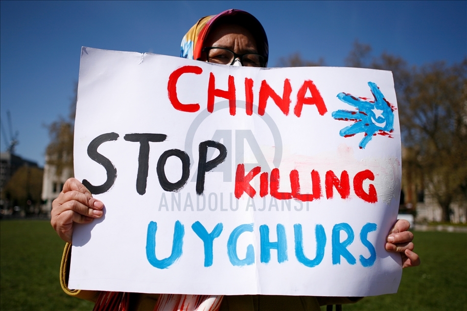 Activists protest outside Parliament as MPs debate China's treatment of Uighur Muslims