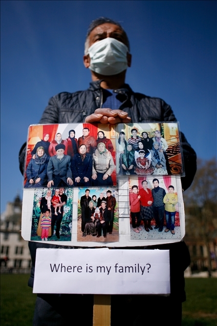 Activists protest outside Parliament as MPs debate China's treatment of Uighur Muslims