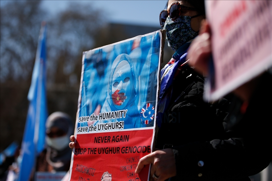 Activists protest outside Parliament as MPs debate China's treatment of Uighur Muslims