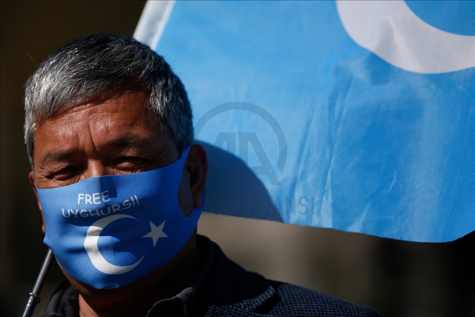 Activists protest outside Parliament as MPs debate China's treatment of Uighur Muslims
