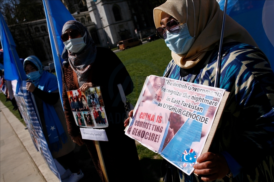 Activists protest outside Parliament as MPs debate China's treatment of Uighur Muslims