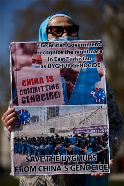 Activists protest outside Parliament as MPs debate China's treatment of Uighur Muslims