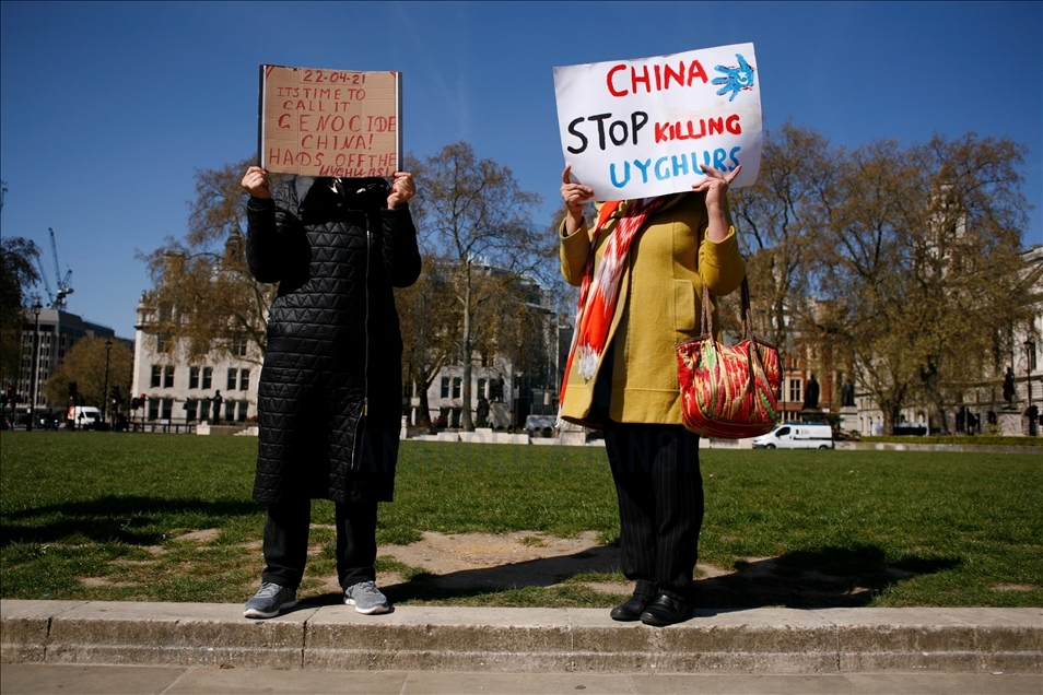 Activists protest outside Parliament as MPs debate China's treatment of Uighur Muslims