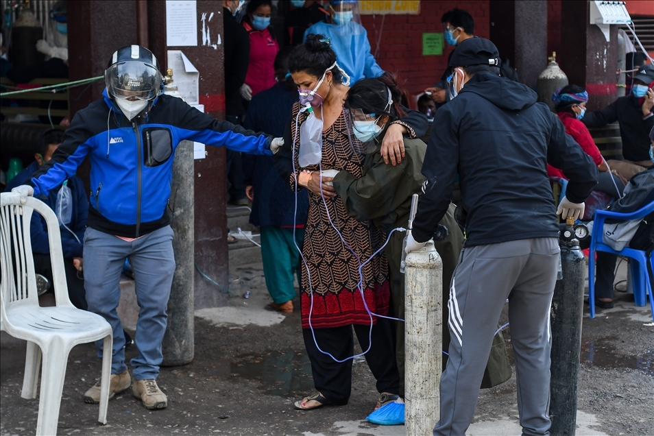 Covid-19 patients get treatment outside the passage of a hospital due to a lack of free beds in Nepal