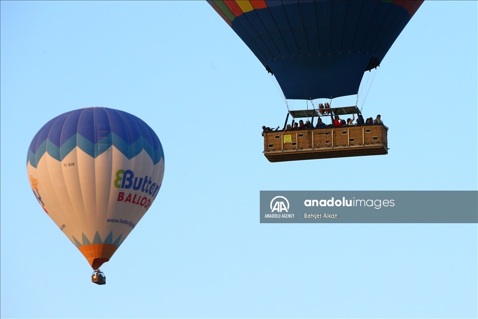 Hot-air balloons glide in Turkey's Nevsehir