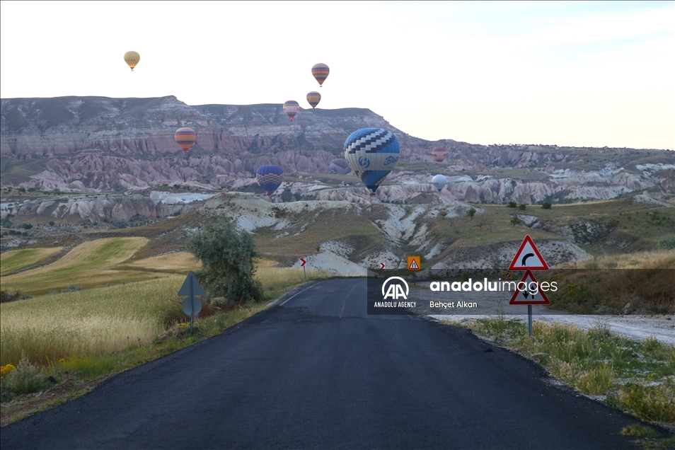 Hot-air balloons glide in Turkey's Nevsehir