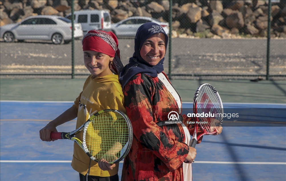 Fatma Karakeci, mother of 3 plays tennis with her local clothes in Turkey's Sanliurfa
