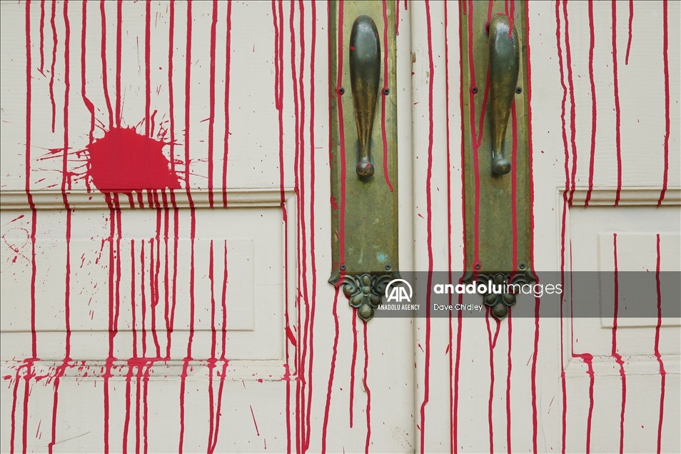 Churches in Canada's Calgary painted with red and orange paint