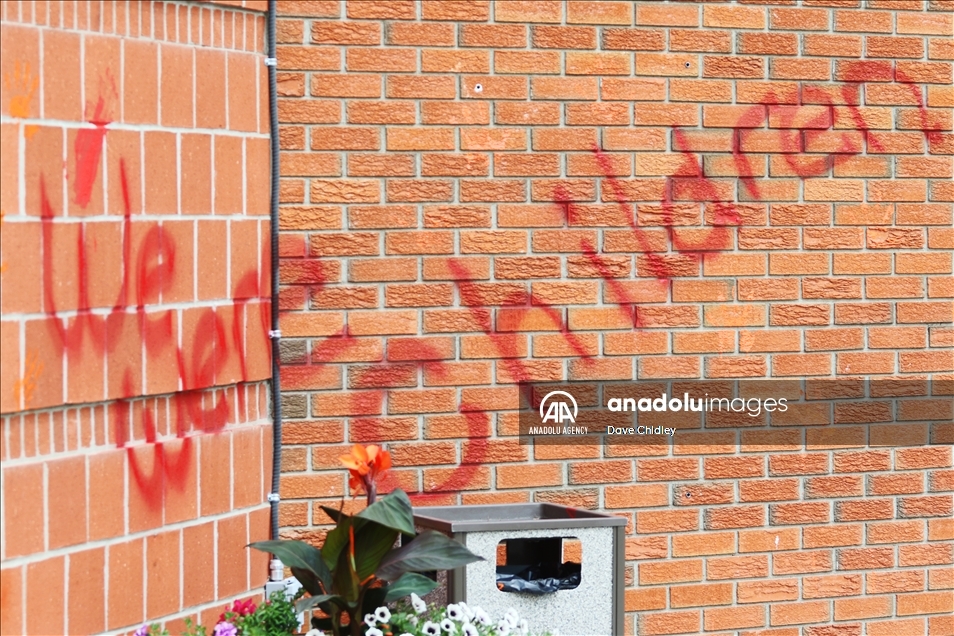 Churches in Canada's Calgary painted with red and orange paint