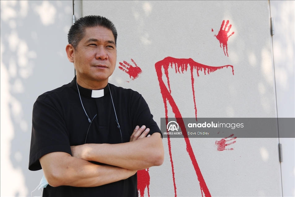 Churches in Canada's Calgary painted with red and orange paint