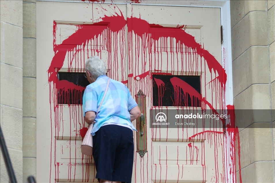 Churches in Canada's Calgary painted with red and orange paint