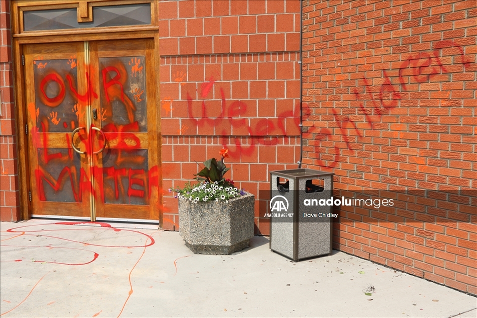 Churches in Canada's Calgary painted with red and orange paint
