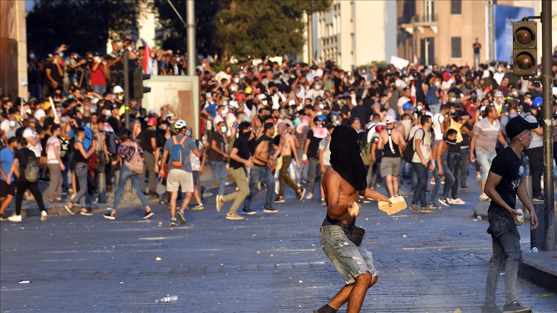 Police intervene in Lebanese protesters gather to mark a year since Beirut's Port explosion