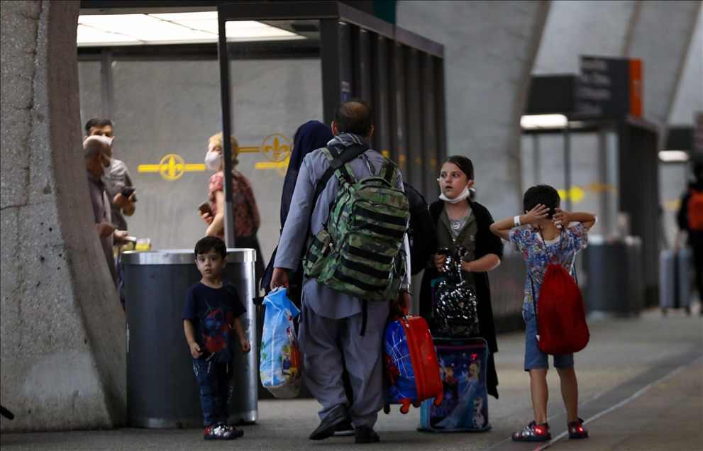 Afghan refugees families evacuated from Kabul arrive in Washington Dulles International Airport
