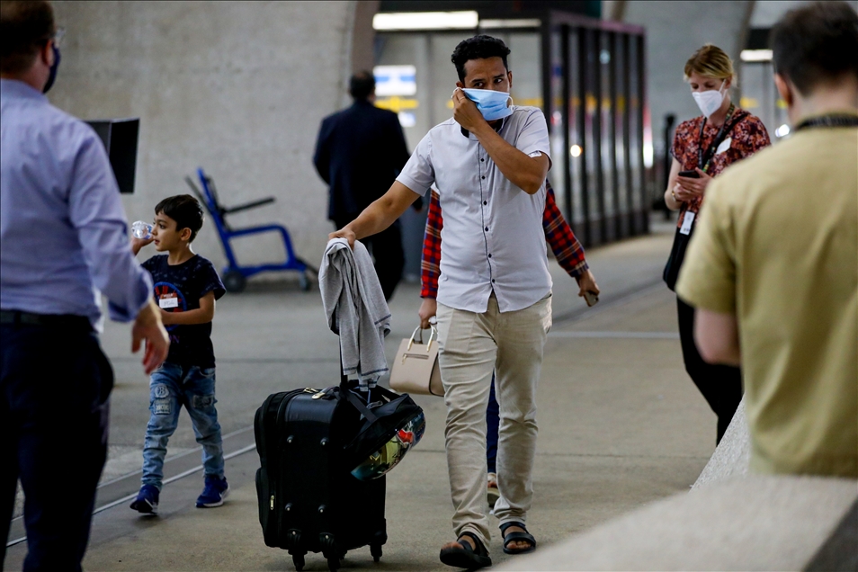 Afghan refugees families evacuated from Kabul arrive in Washington Dulles International Airport