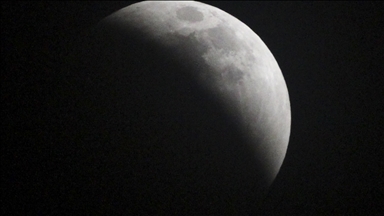 Super blood Moon emerges from gloom, as total lunar eclipse is seen around the world