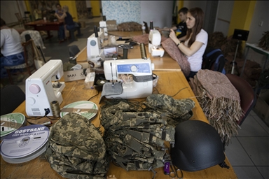 Ukrainians weave camouflage nets for armed forces in Kyiv 