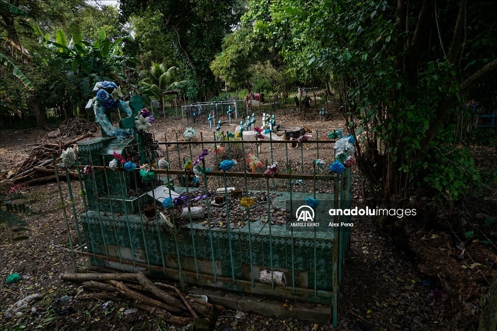 Graves in the yards of houses during dead day in El Salvador
