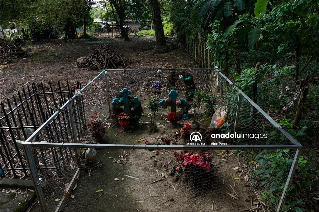 Graves in the yards of houses during dead day in El Salvador