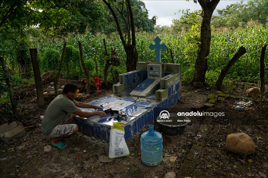 Graves in the yards of houses during dead day in El Salvador