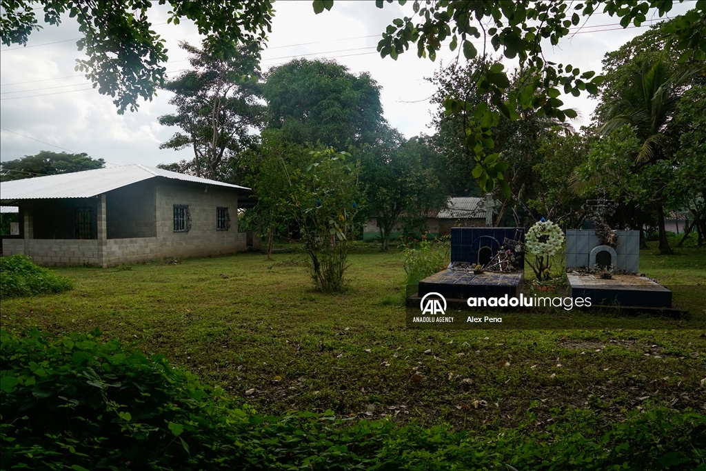 Graves in the yards of houses during dead day in El Salvador