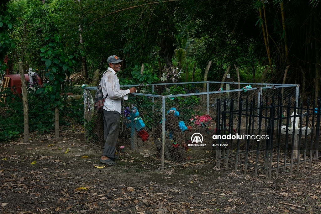 Graves in the yards of houses during dead day in El Salvador