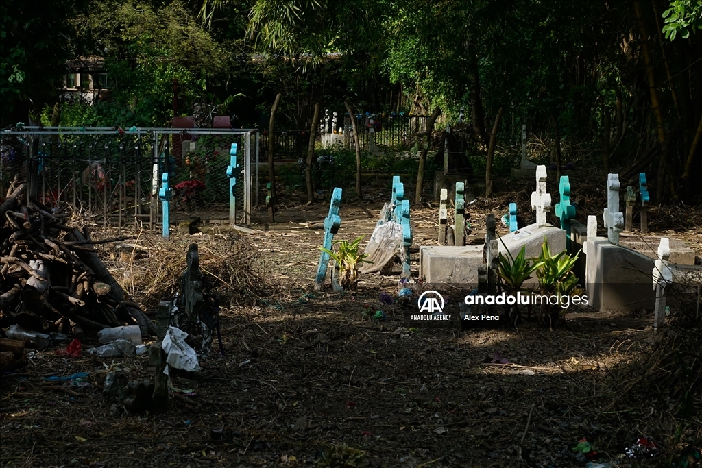Graves in the yards of houses during dead day in El Salvador
