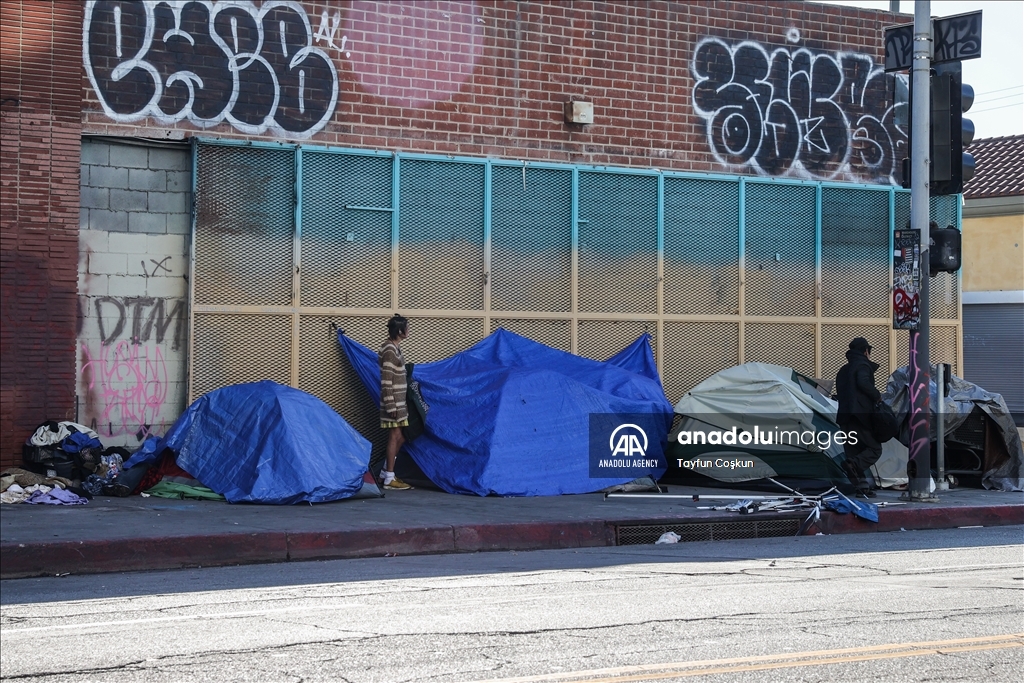 Homeless people and tents are on sidewalks in Los Angeles, California ...