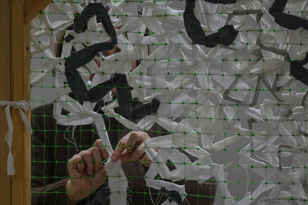 Ukrainians weave camouflage nets for the Ukrainian army