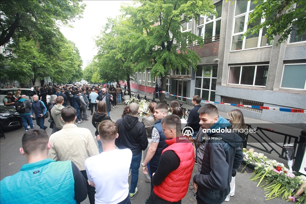 Thousands gather to pay tribute to victims of school shooting in Serbia