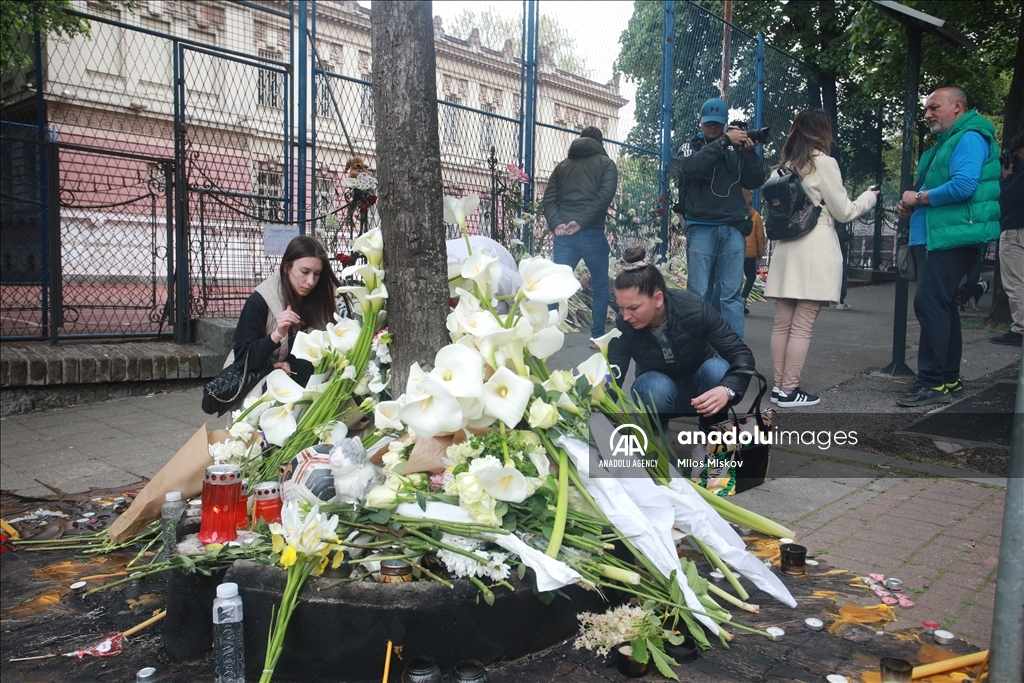 Thousands gather to pay tribute to victims of school shooting in Serbia