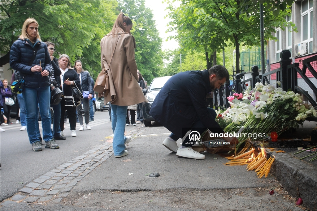 Thousands gather to pay tribute to victims of school shooting in Serbia