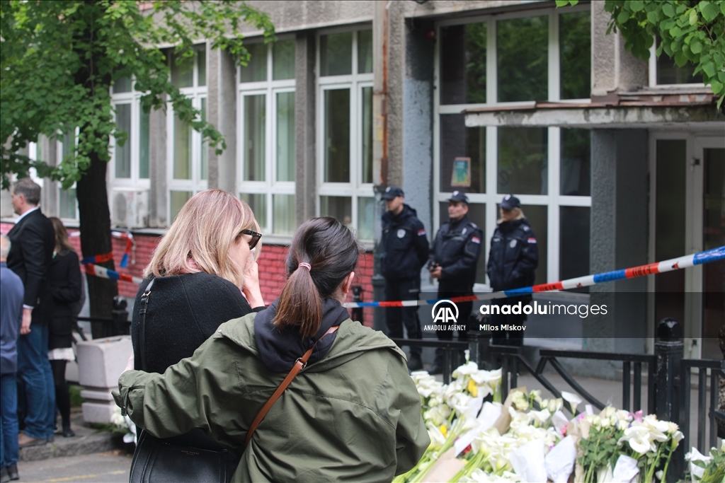 Thousands gather to pay tribute to victims of school shooting in Serbia